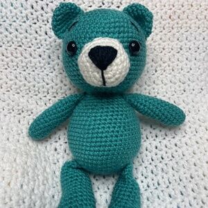 crocheted teal colored teddy bear